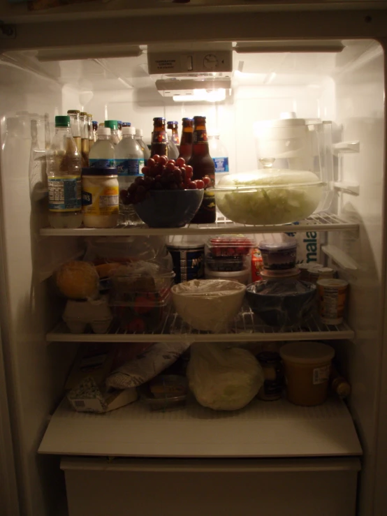 an open refrigerator with all the food inside