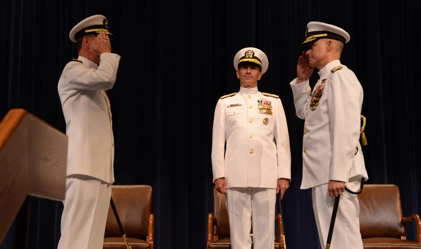 a bunch of military men in uniform saluting to each other