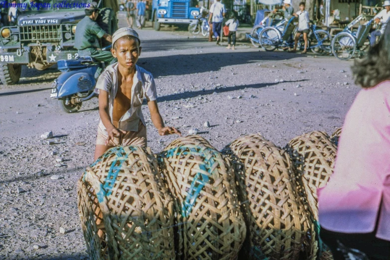 a person sitting on three balls of woven material