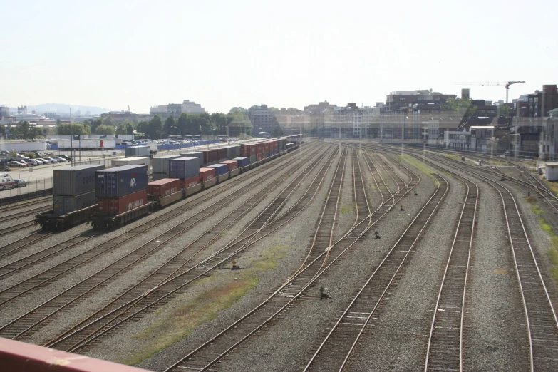 a train yard in a small city with many rail road tracks