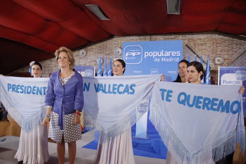 a group of women holding up sign's to vote