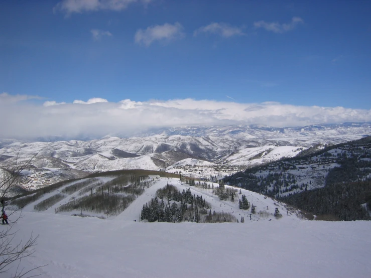 a person standing on the top of a ski slope