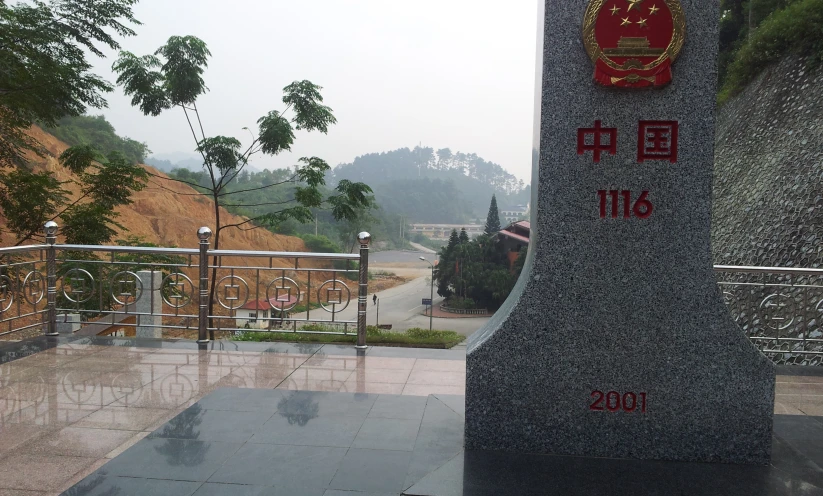 a couple of large stone sculptures on a walkway