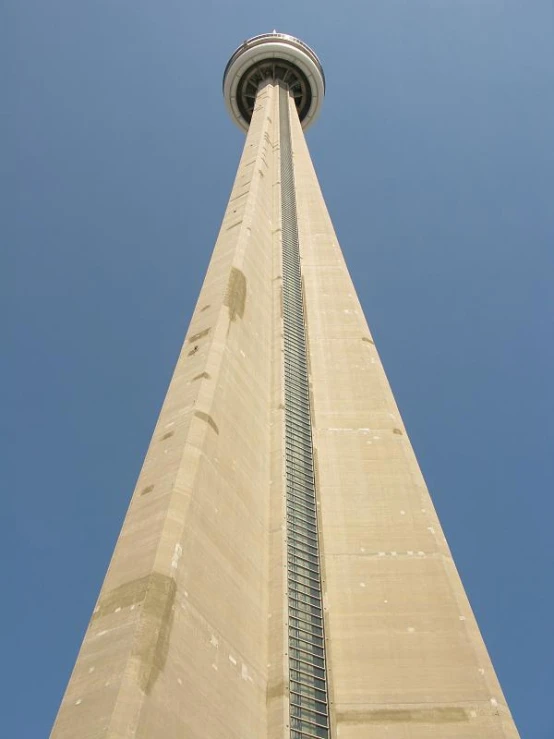 the side view of a tall, white tower that looks down