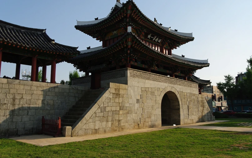 an old building is surrounded by large asian architecture