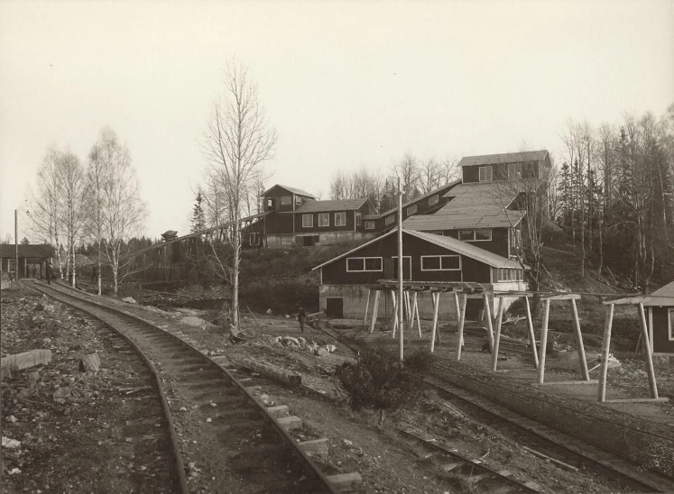 a train yard with tracks and multiple building