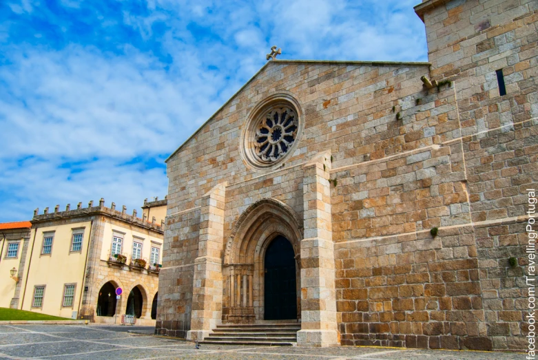 a church building has two doors and a window in the center