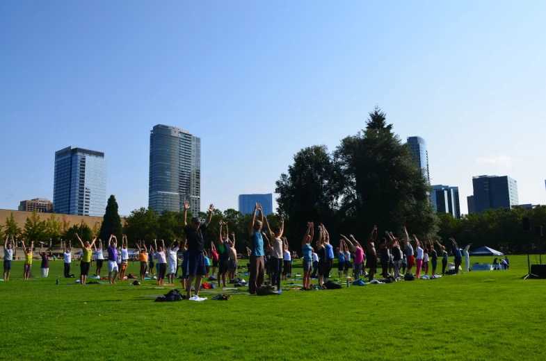 a group of people standing in a field