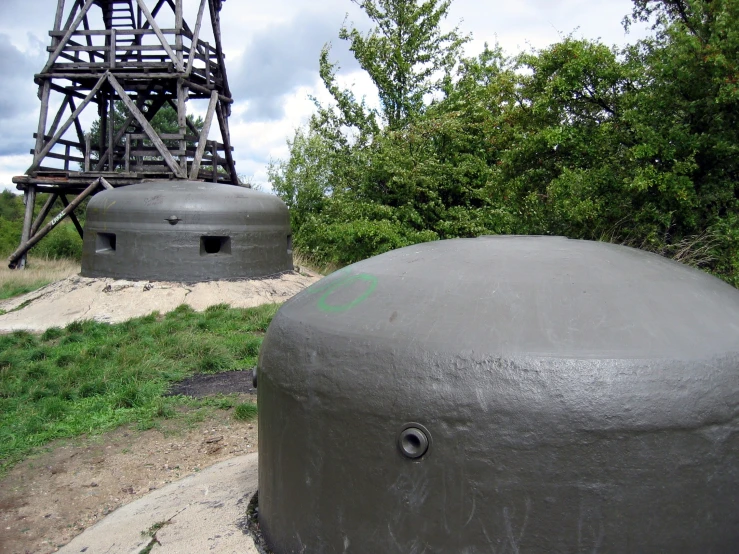 two cement tanks sit side by side outside