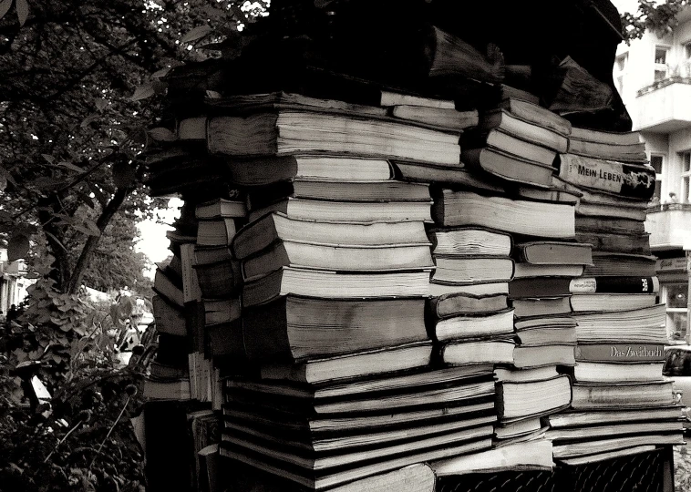 a stack of books is in black and white