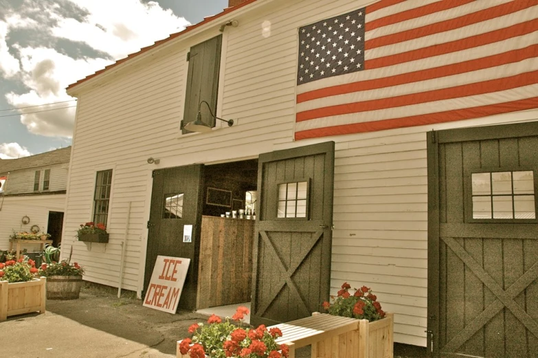 the american flag is on display outside of the shop