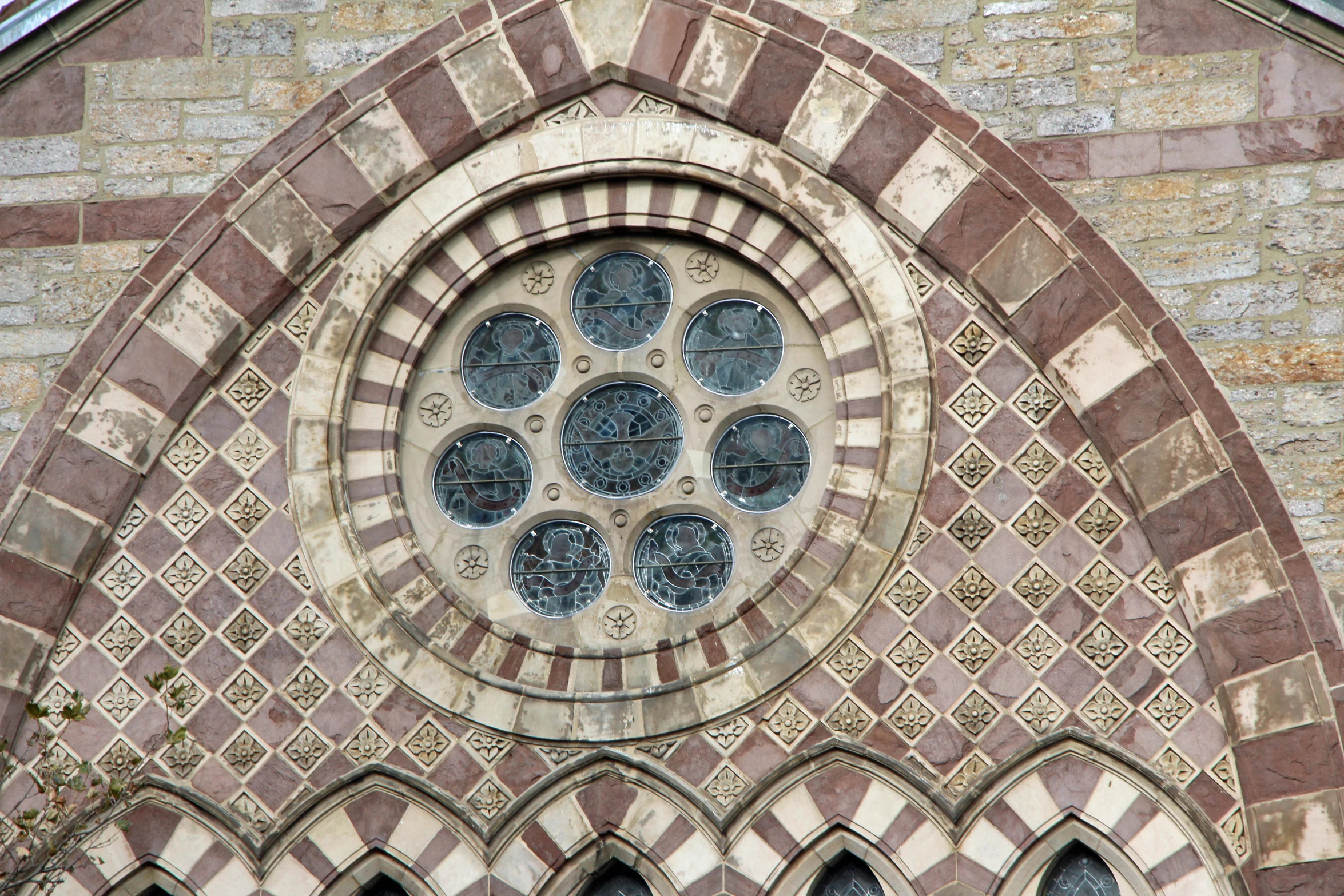 a large stone window with ornately decorated designs