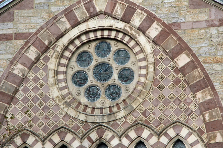 a large stone window with ornately decorated designs