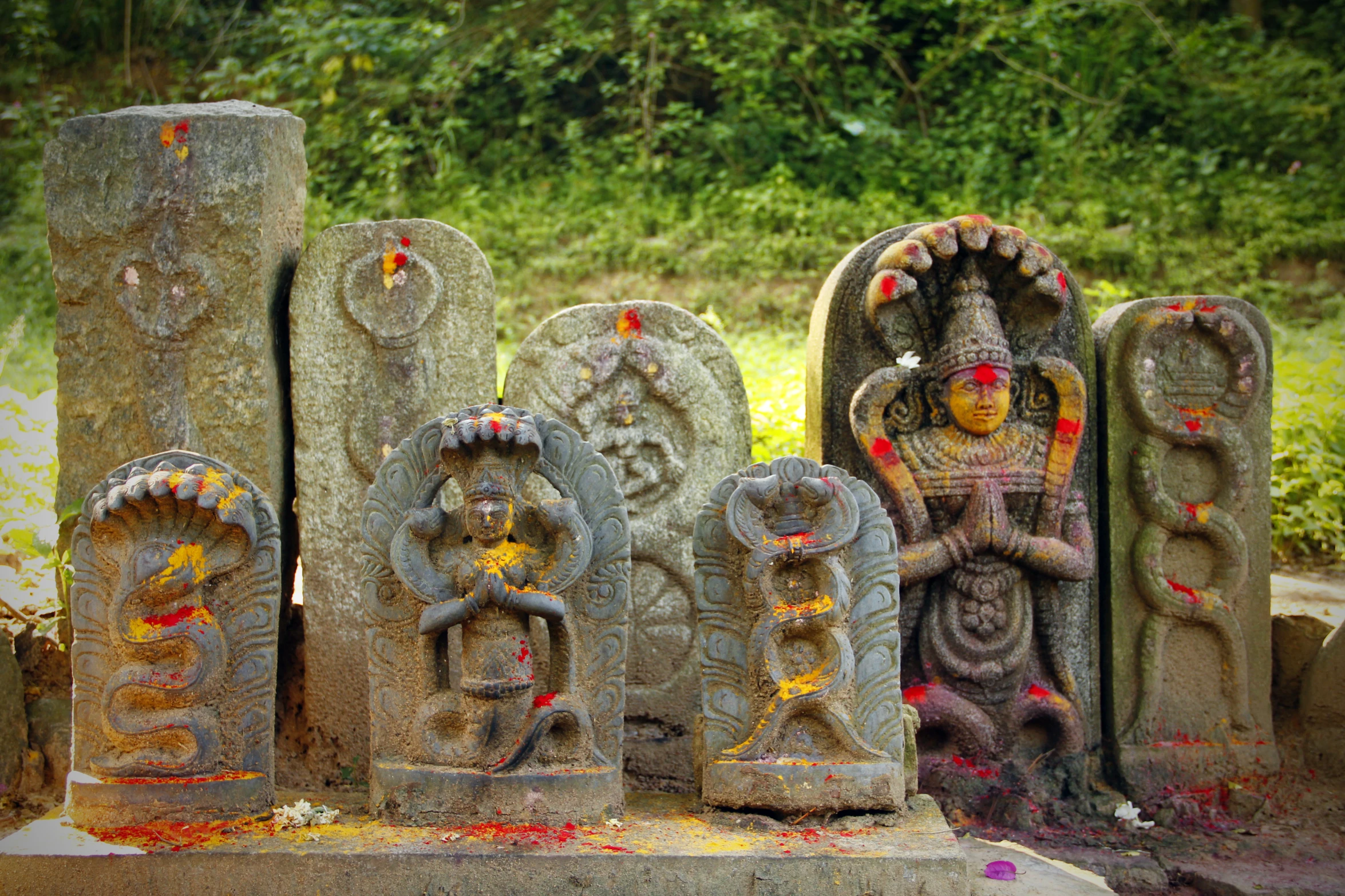 a row of sculptures on the ground