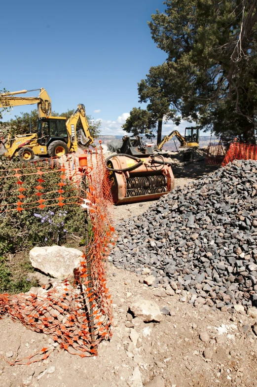 a bulldozer digging through an open landscape