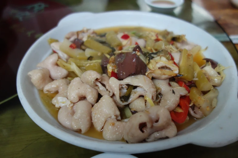 a plate of vegetables, chicken and other foods