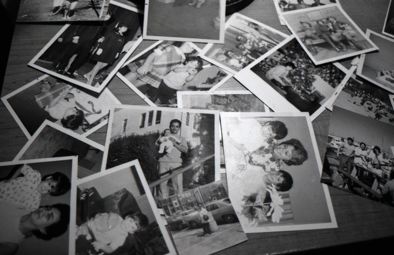 vintage pographs of the same family, as well as people's pictures, are on the table