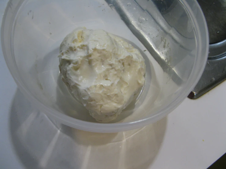 a bowl filled with uncooked food on top of a counter