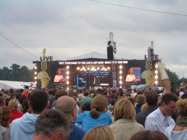 some people in an audience with one person at the stage