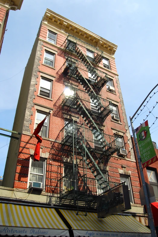 some buildings with a lot of metal stairs