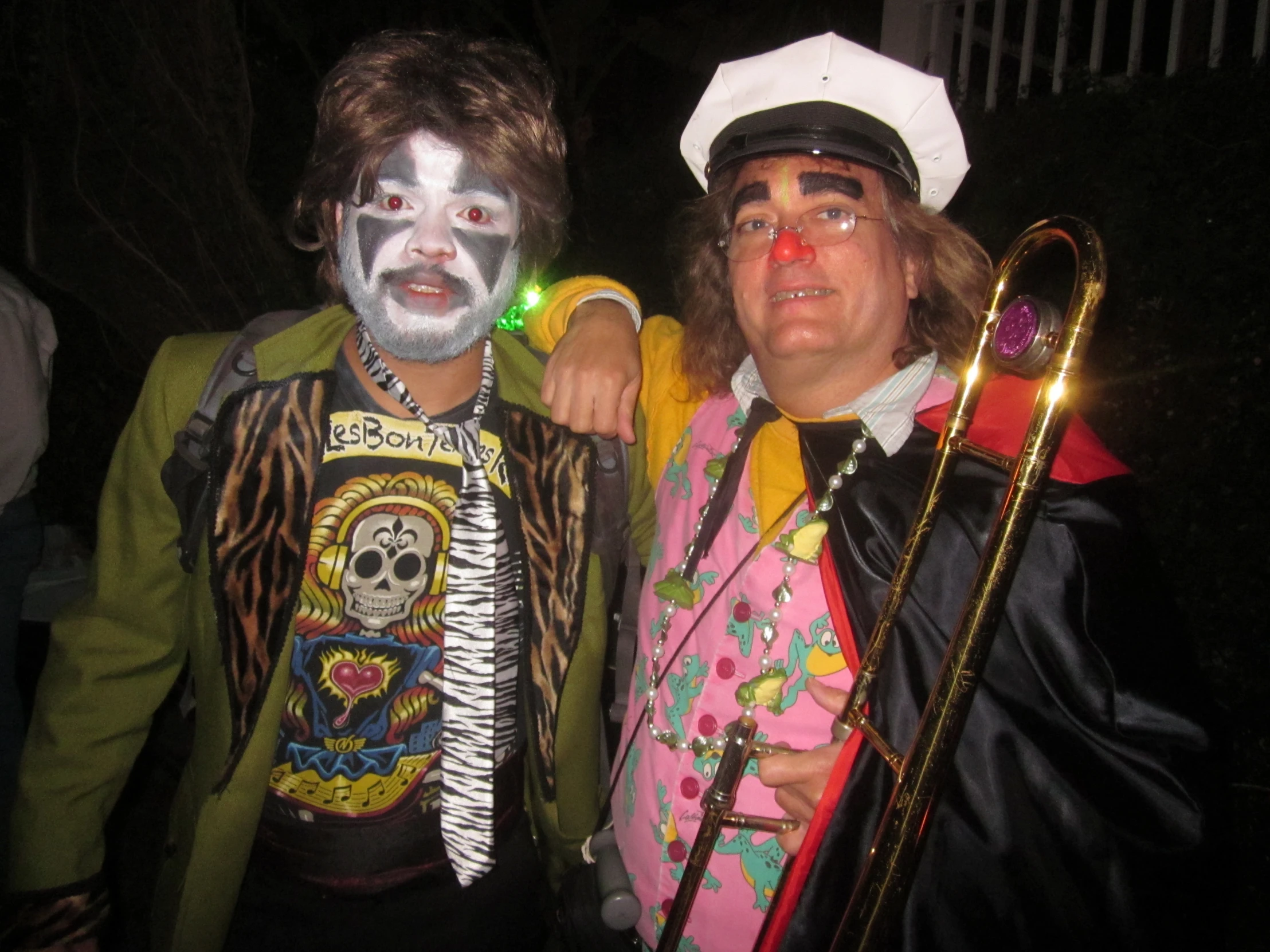 two clowns at an event with different costumes