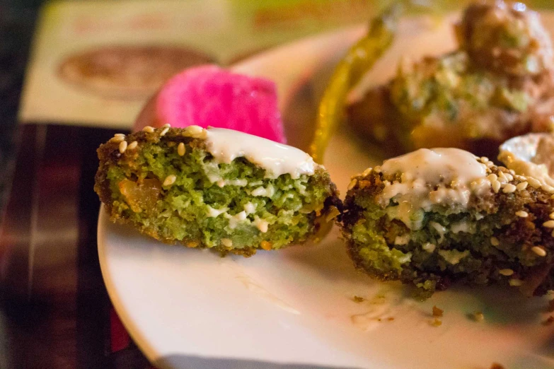 some green and white desserts on a plate