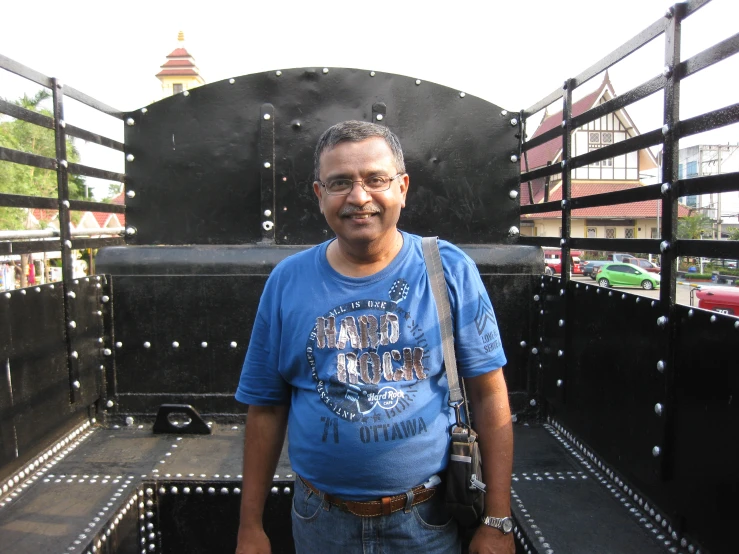 a man standing in the back of a truck