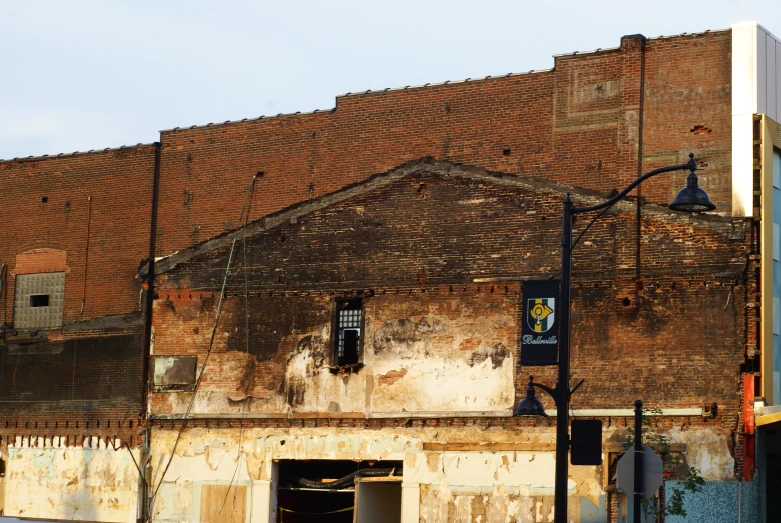 a brick building with a very large white roof