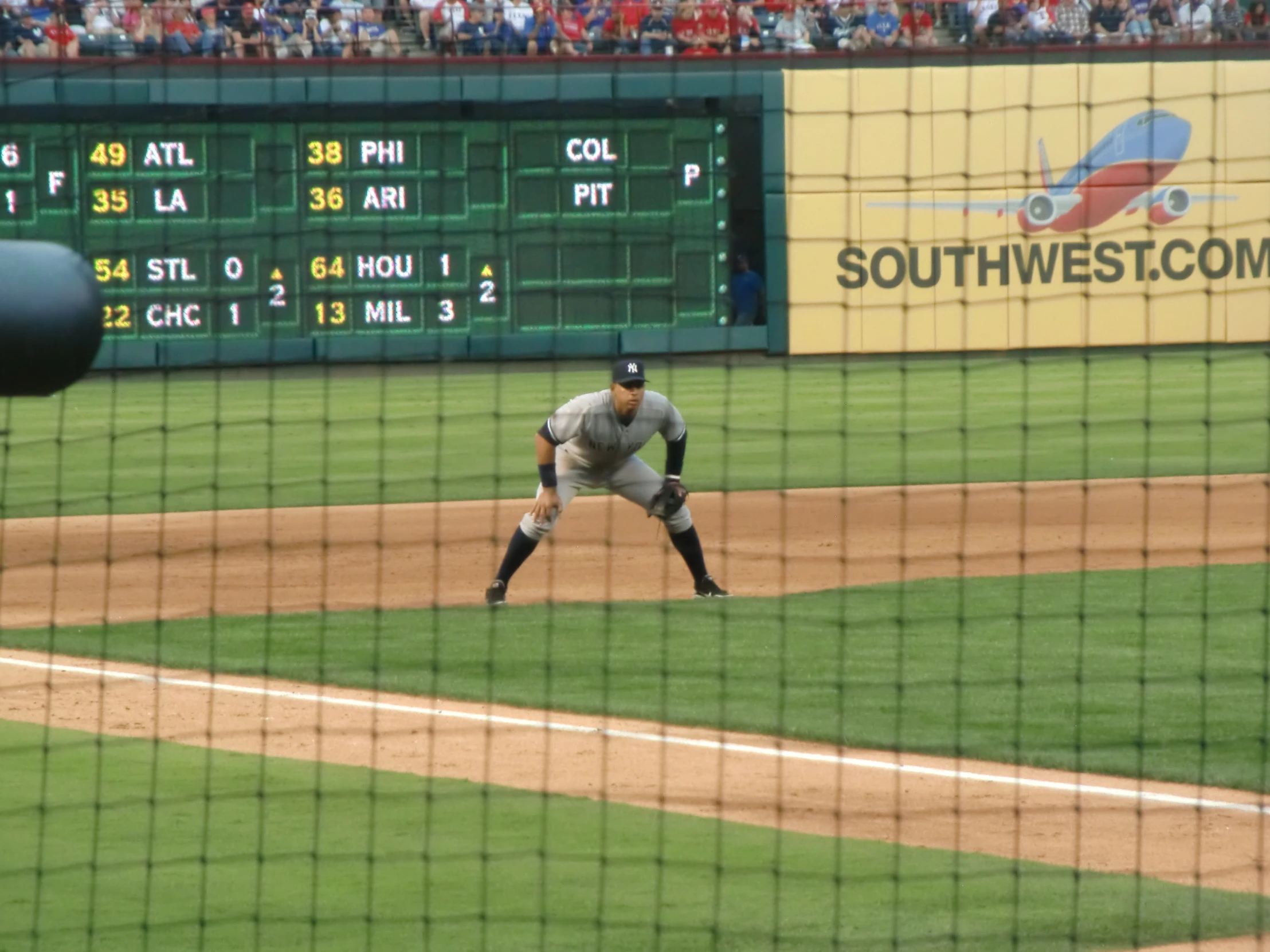 a man standing on top of a baseball field