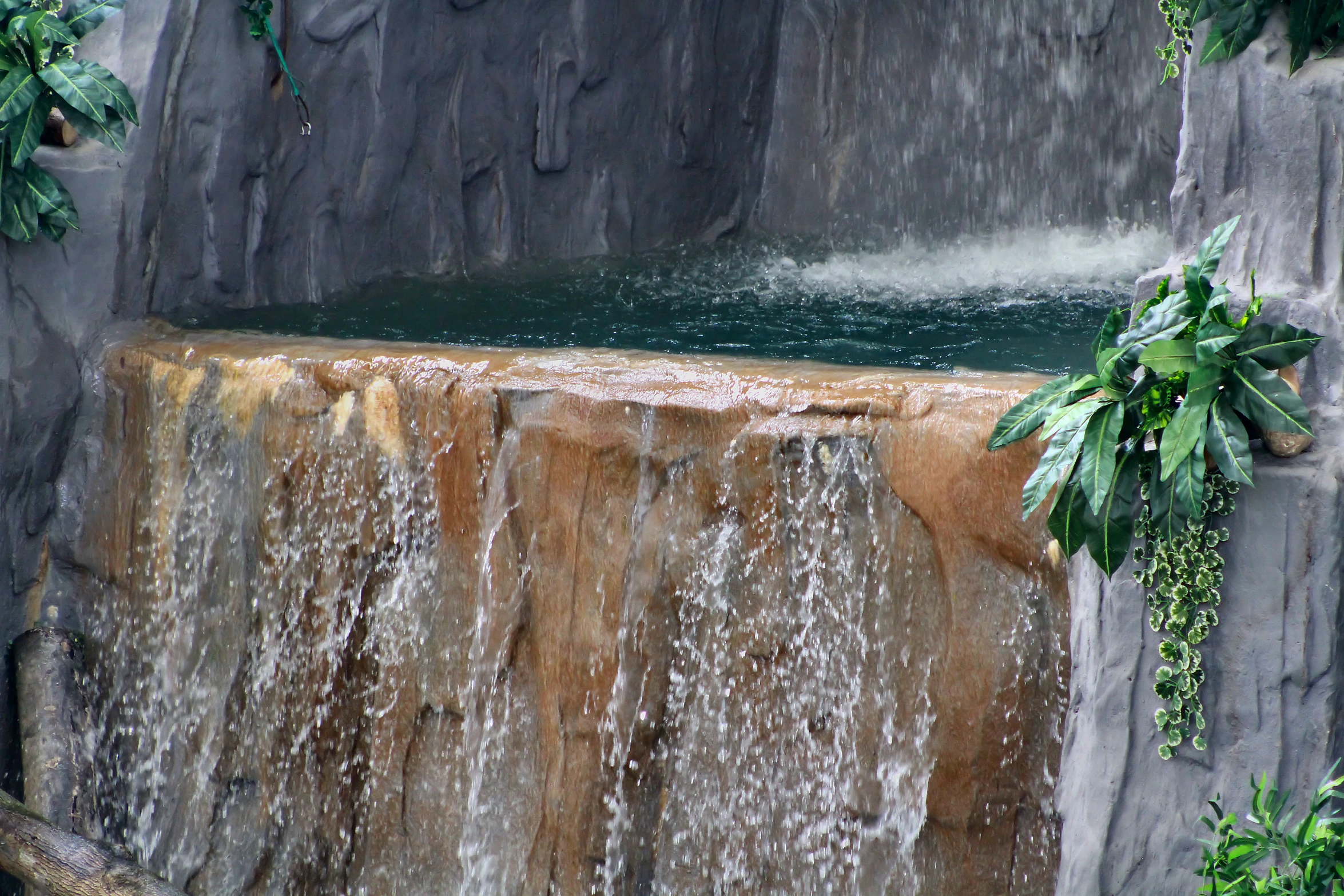 an image of water falling off of a waterfall