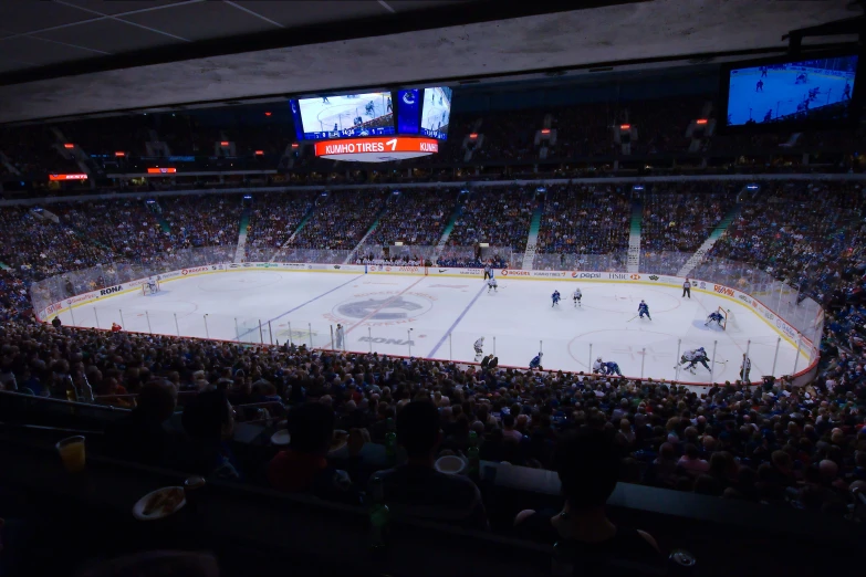 a hockey game being played on the ice