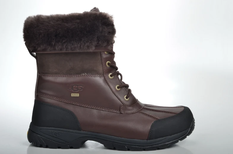 a brown boot with a fuzzy collar on a white surface