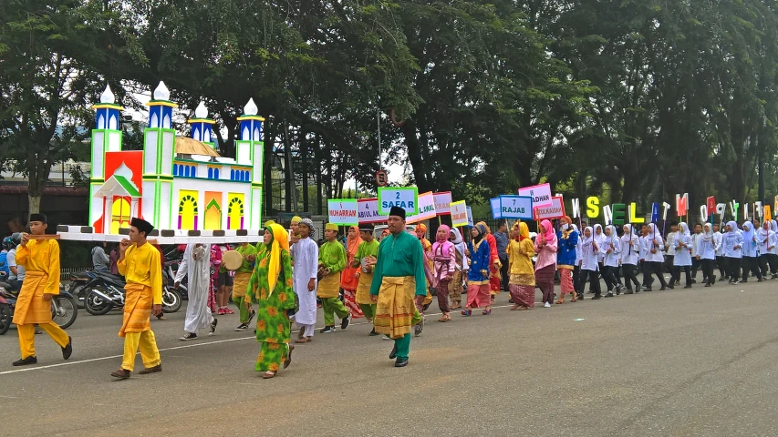 a group of people walking on a road holding flags