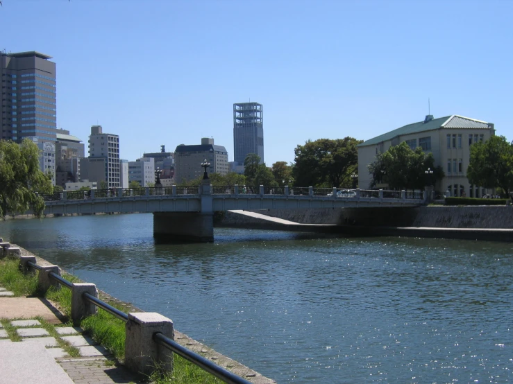 there is a long bridge crossing a river