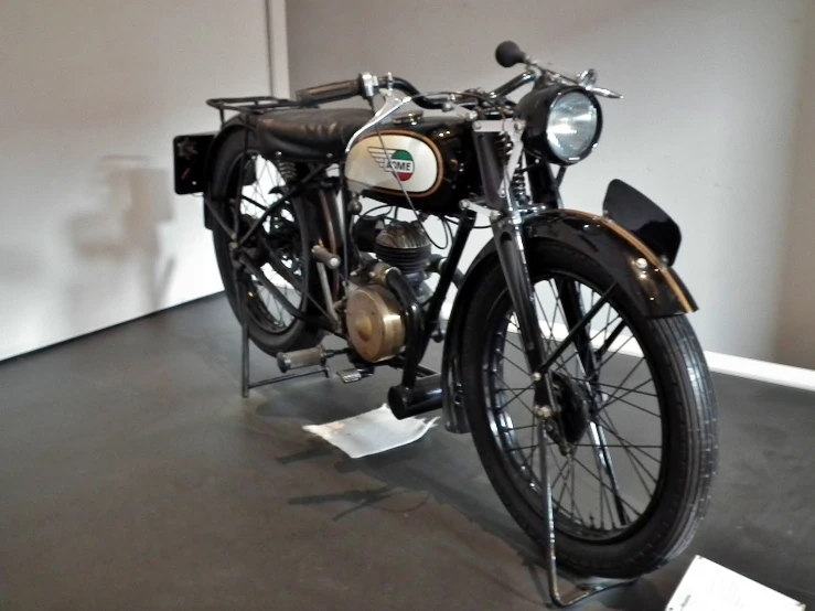 old bike parked in a museum with no people