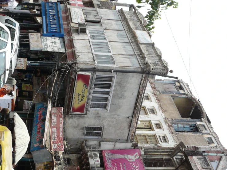 a few cars on a street with many different buildings