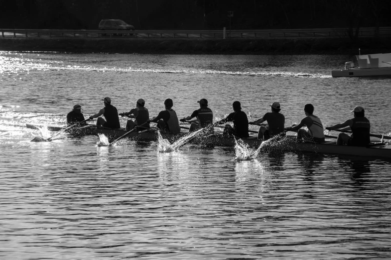 a row boat race is on the water