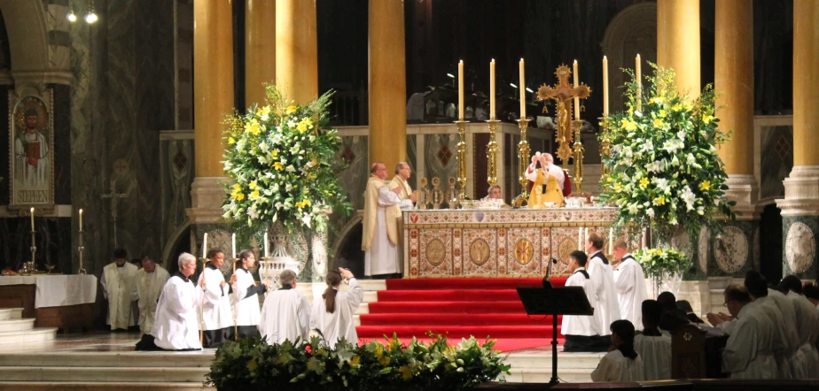 a group of men standing on stage in a church