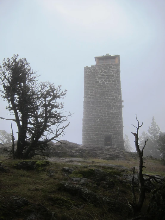 the tall stone structure is sitting alone