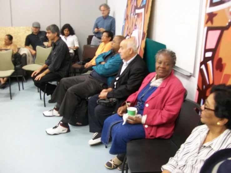 a group of people are sitting in rows together