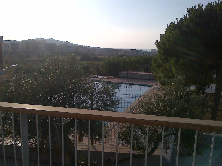 a deck overlooks a lake at dusk