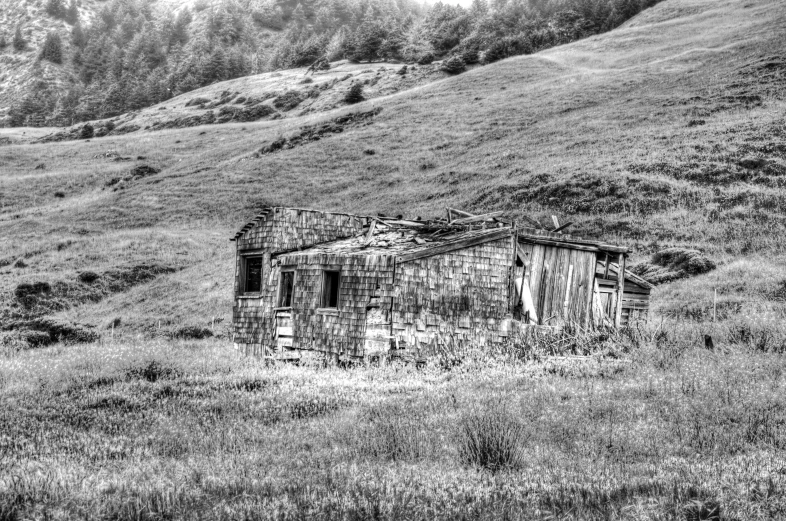 an old wooden shack in the country side