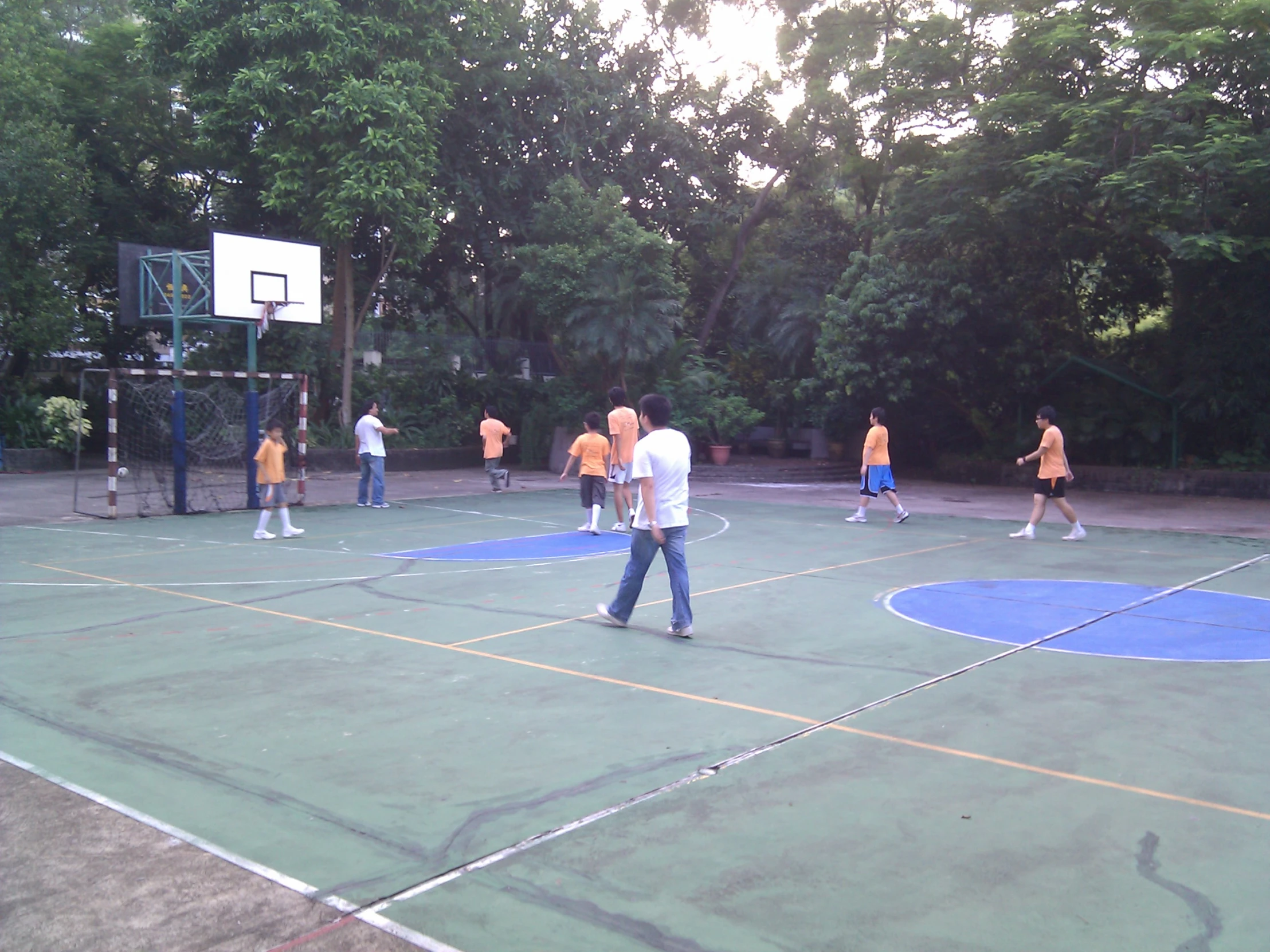 a group of s play on a basketball court