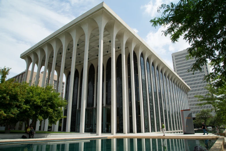 large white columns and architecture over a body of water