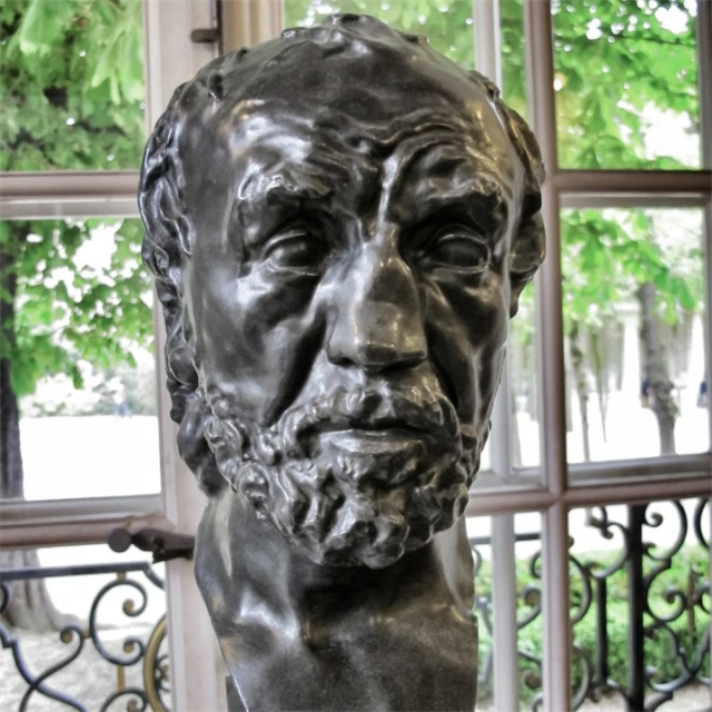 a statue of the writer nikola nikola nikola is pictured near a window in a building