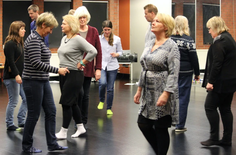 an image of group of people standing in a room