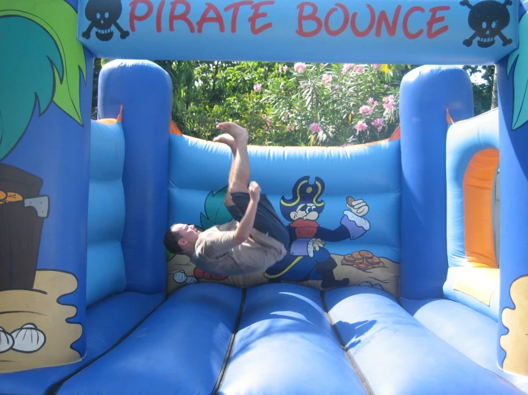 a man is on his stomach on an inflatable bouncer