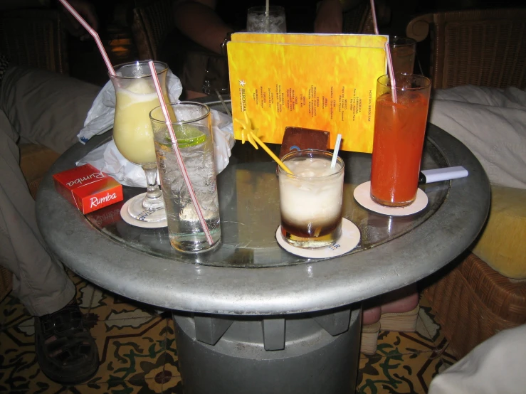 a metal table with drinks on it