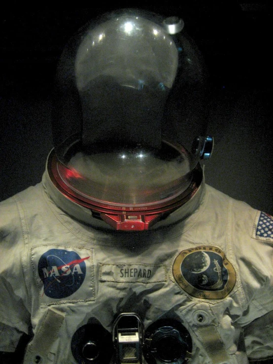 an astronaut's space suit on display in a museum