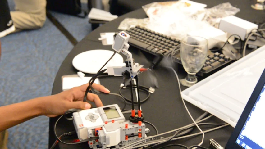 a person is looking at his toy robot